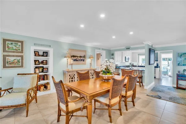a dining room with a table and chairs