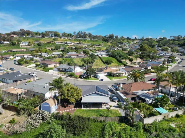 an aerial view of residential houses with outdoor space