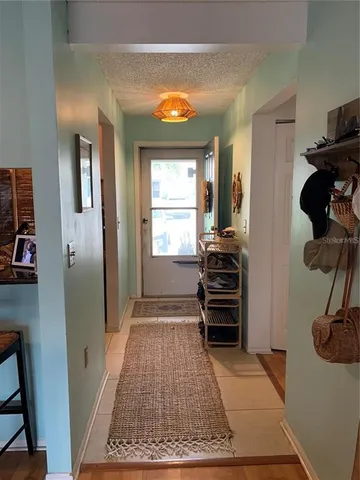 a kitchen with stainless steel appliances granite countertop a refrigerator and a stove