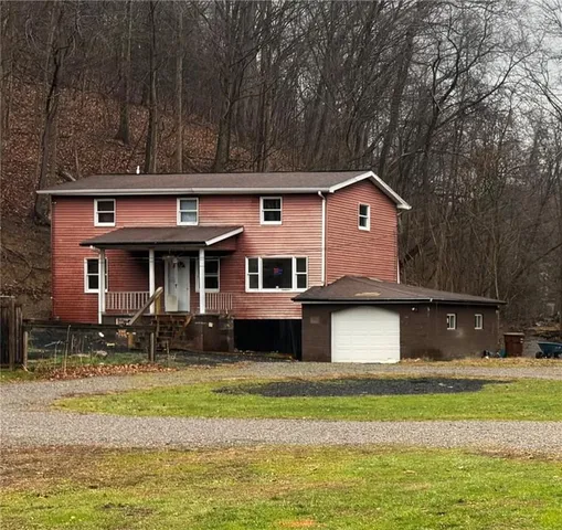 a house with swimming pool in front of it