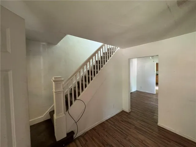 a view of entryway with wooden floor