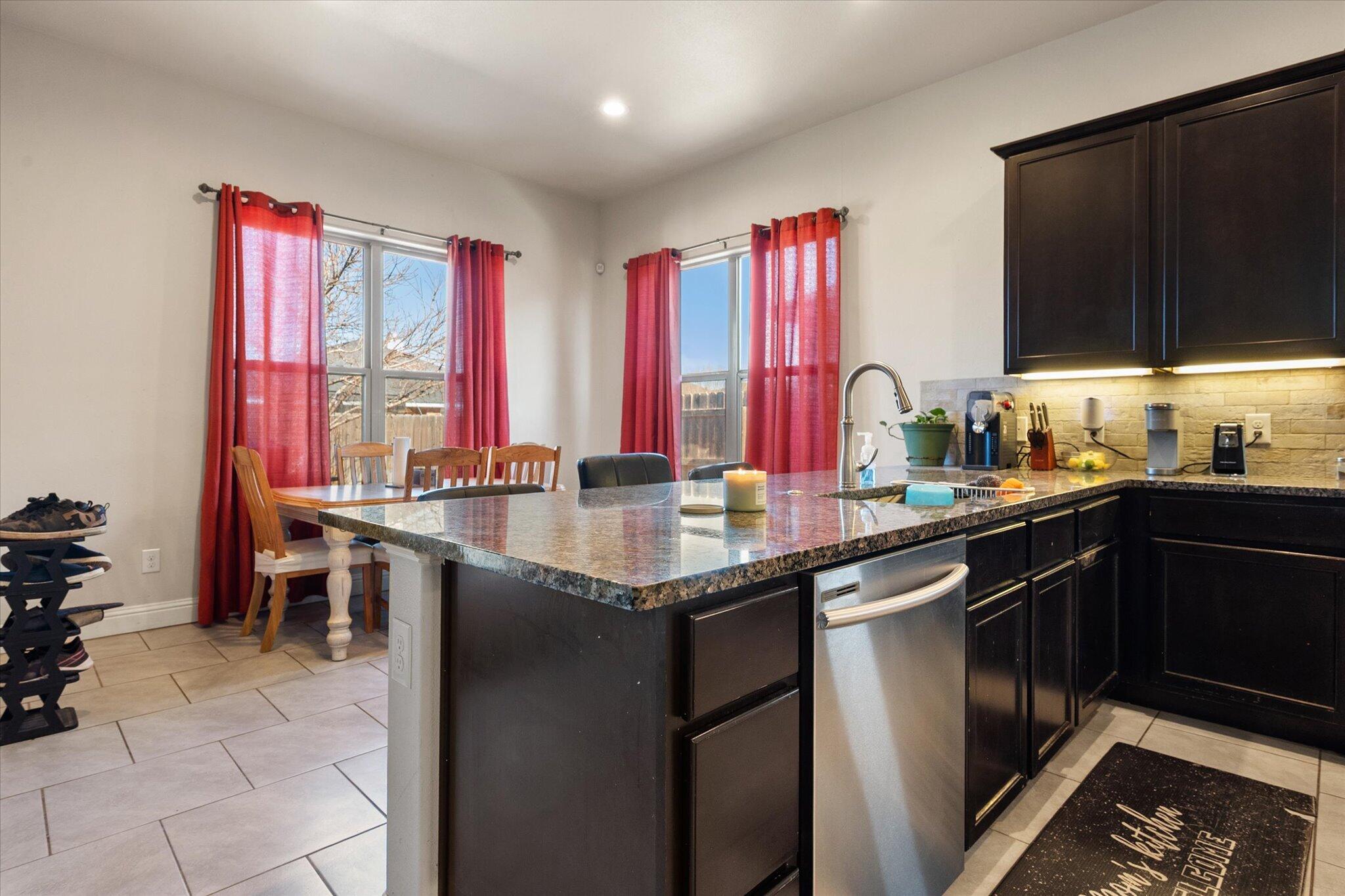 7038 95th Street Lubbock, TX 79424 - Photo 9 of 23 a kitchen with lots of counter top space