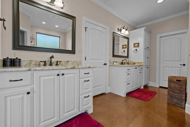 a bathroom with a sink vanity and mirror