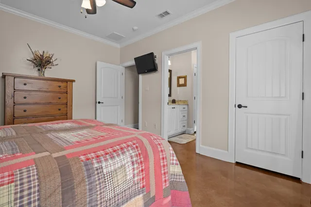 a bedroom with a bed and a dresser