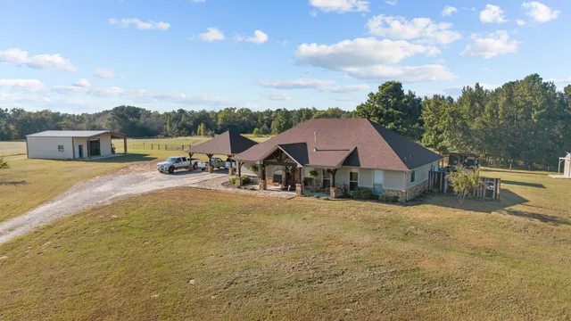 a view of a house with a big yard