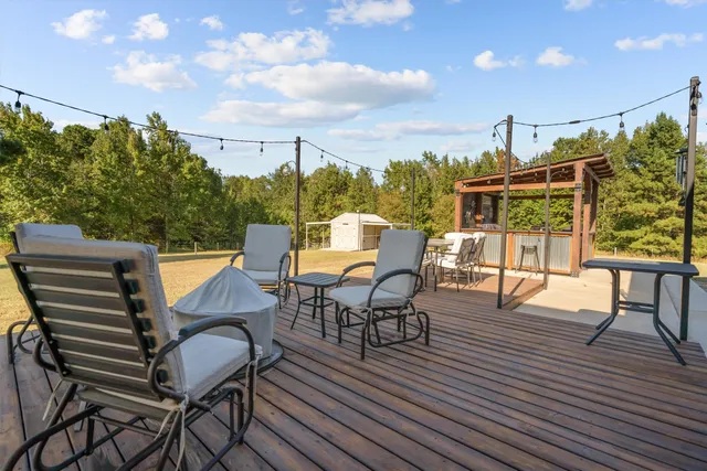 a view of a chairs and table on the deck