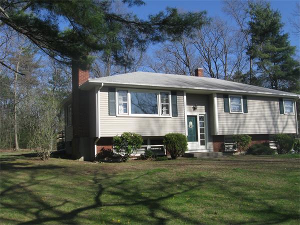 138 Cooper Road Northbridge, MA 01534 - Photo 1 of 6 a front view of a house with a garden