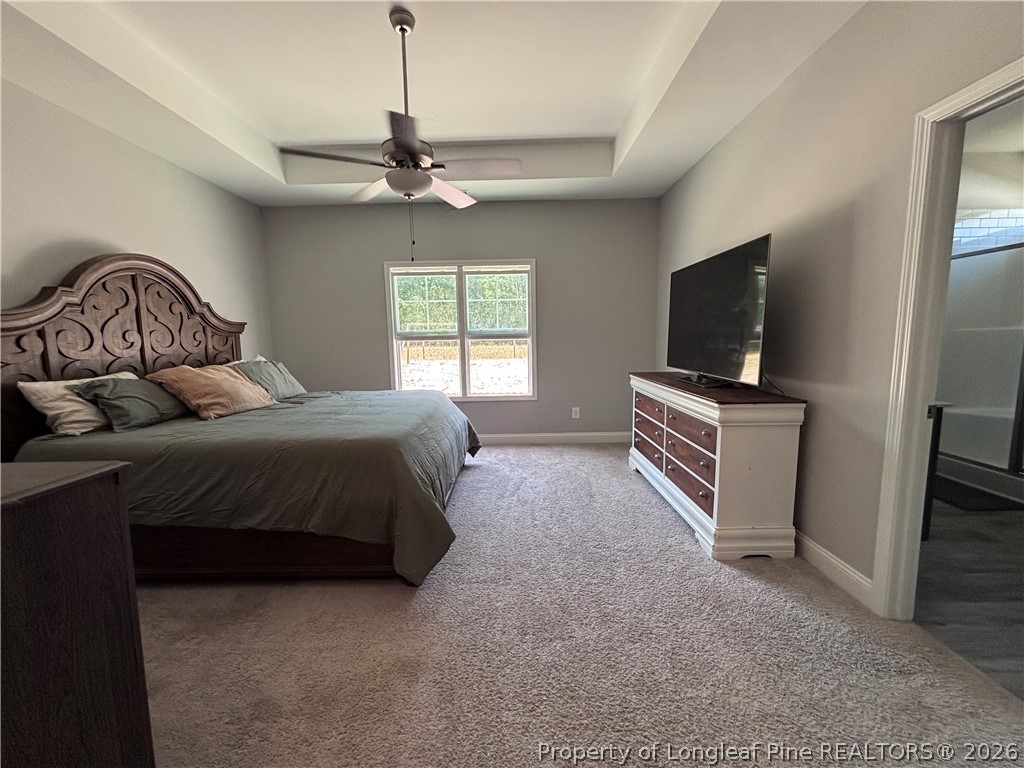 7720 Rufus Johnson Road Fayetteville, NC 28306 - Photo 43 of 50 a bedroom with a bed and a flat screen tv