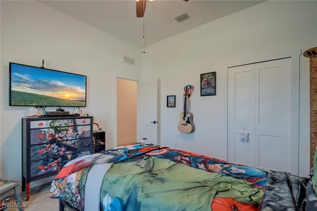 a bedroom with a bed and a desk