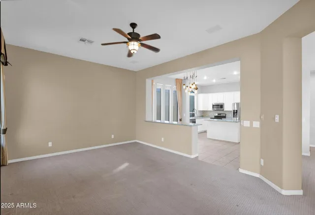 a view of a livingroom with a kitchen