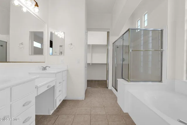 a bathroom with a double vanity sink and mirror