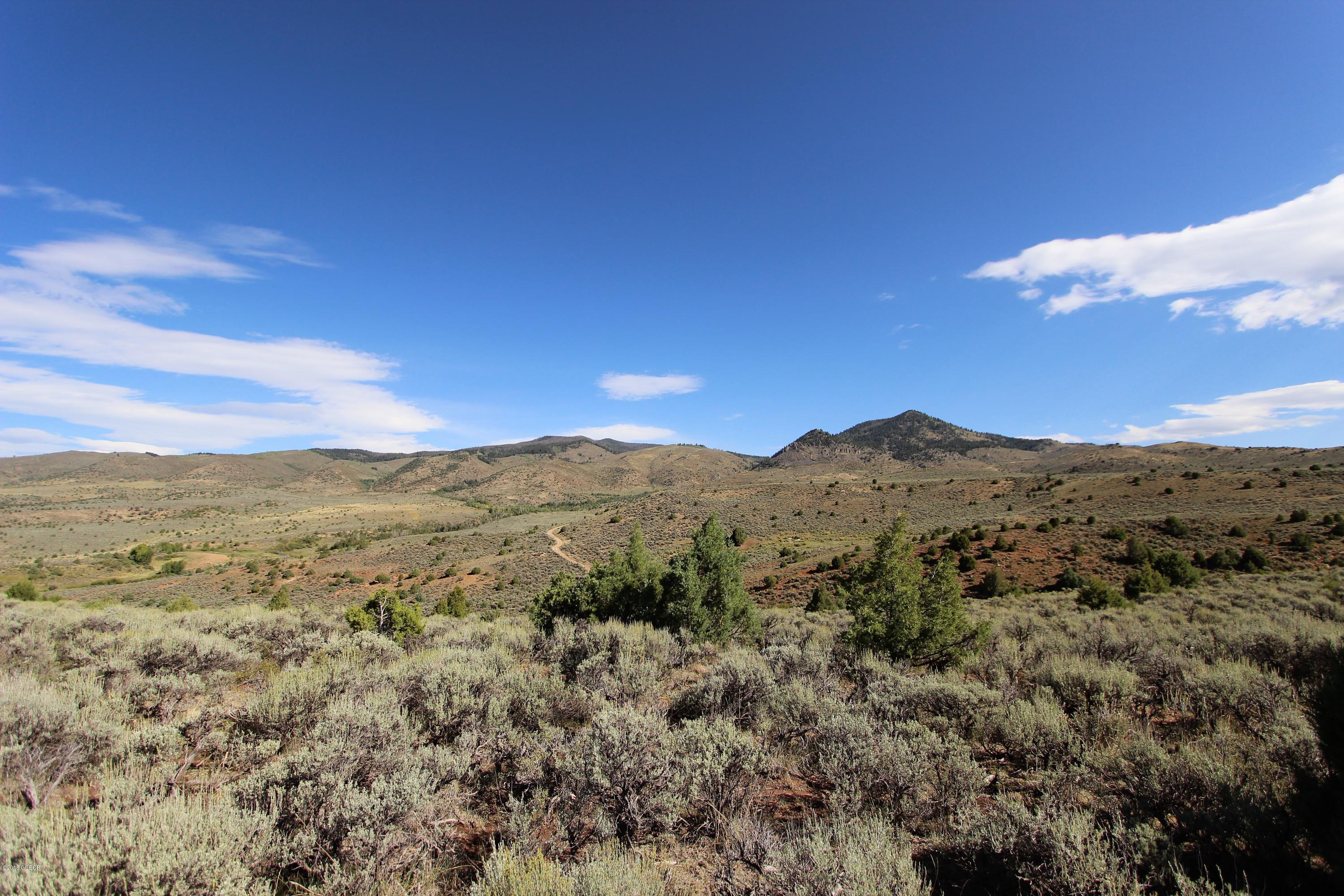 Tbd Copper Spur Road Bond, CO 80423 - Photo 37 of 41 a view of a mountain range in a cloudy sky
