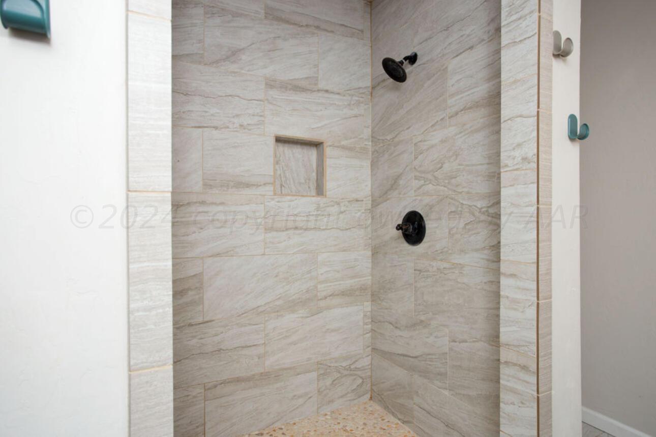 4818 Arden Road Amarillo, TX 79110 - Photo 23 of 29 a bathroom with a shower
