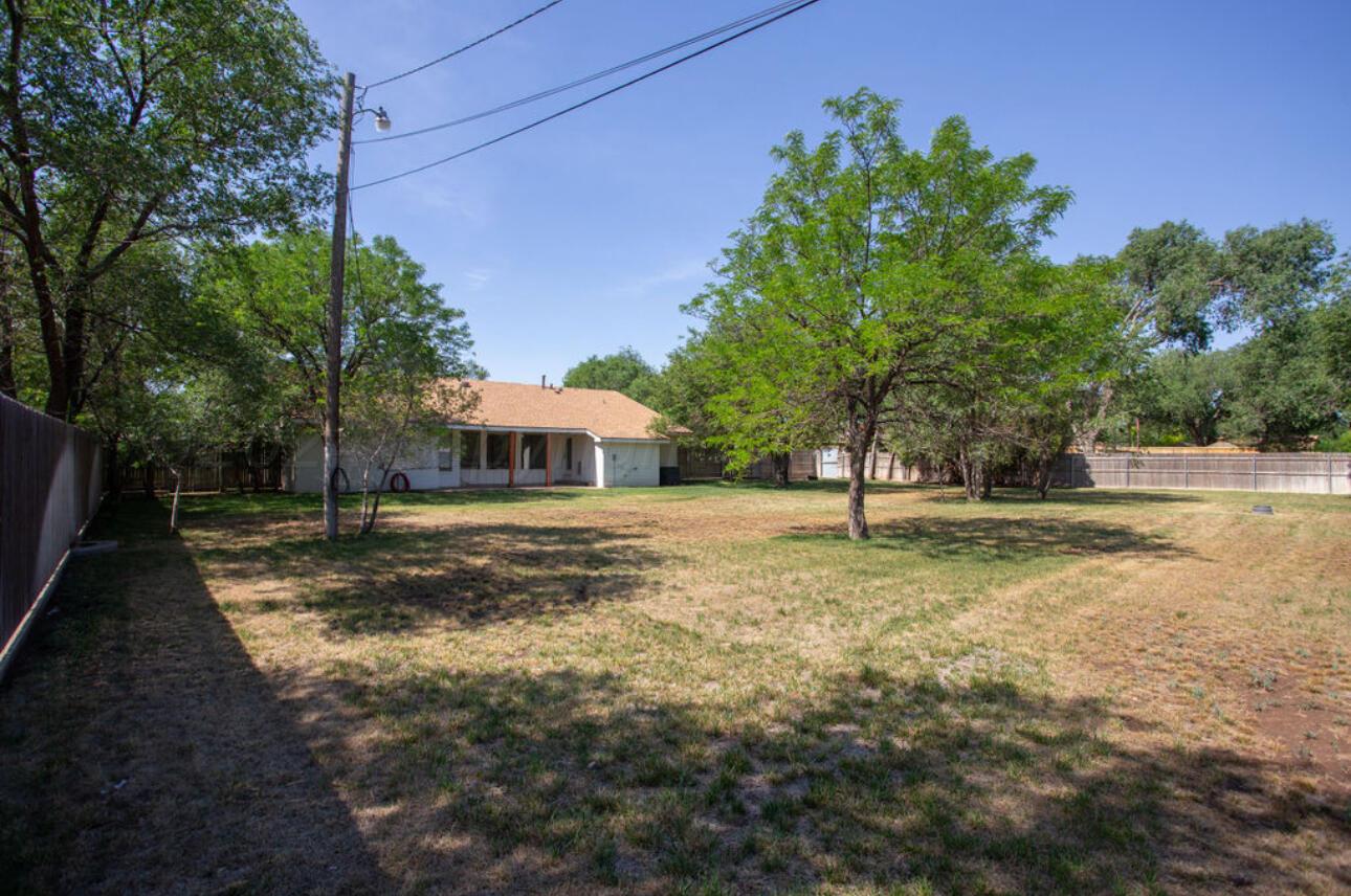 4818 Arden Road Amarillo, TX 79110 - Photo 27 of 29 a view of a house with backyard and trees