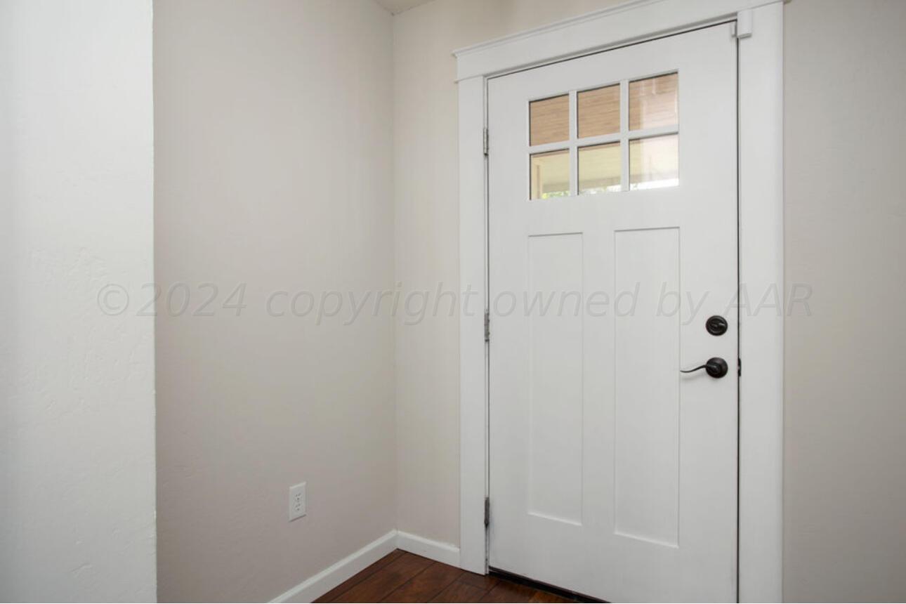 4818 Arden Road Amarillo, TX 79110 - Photo 3 of 29 a view of front door with wooden floor