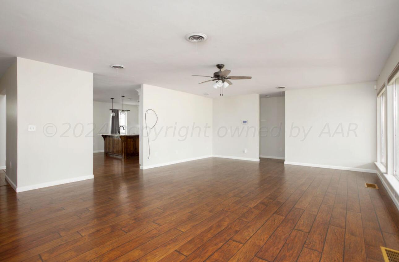 4818 Arden Road Amarillo, TX 79110 - Photo 4 of 29 a view of an empty room and wooden floor