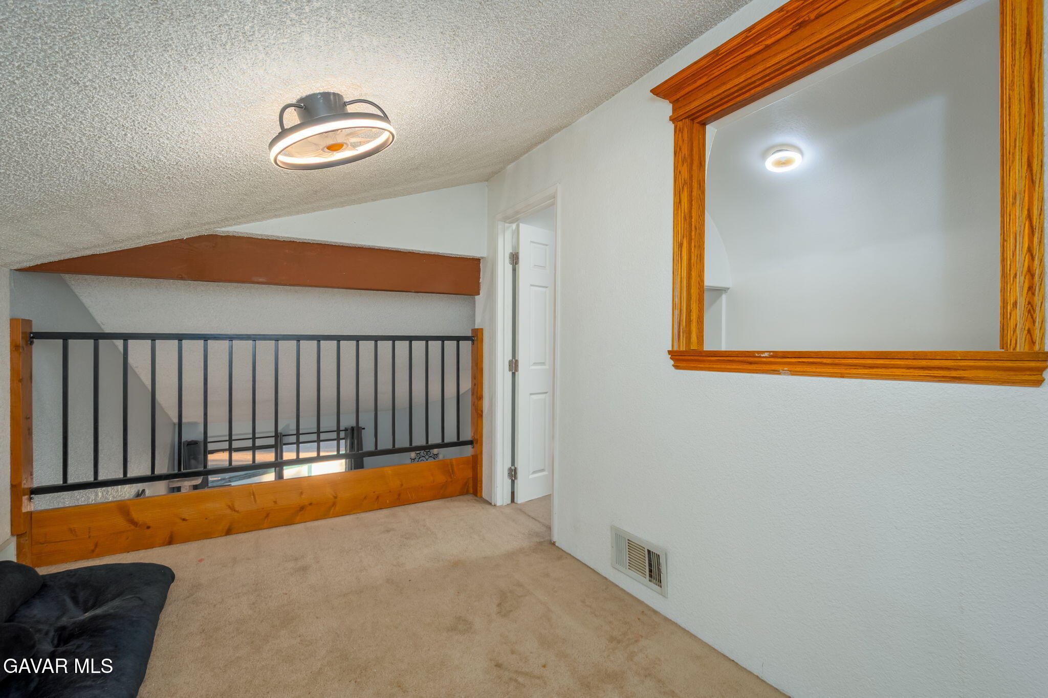 44442 15th Street East, Unit 5 Lancaster, CA 93535 - Photo 15 of 23 a view of a room with a chandelier and wooden floor
