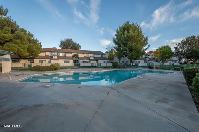 a view of a street with a building in the background