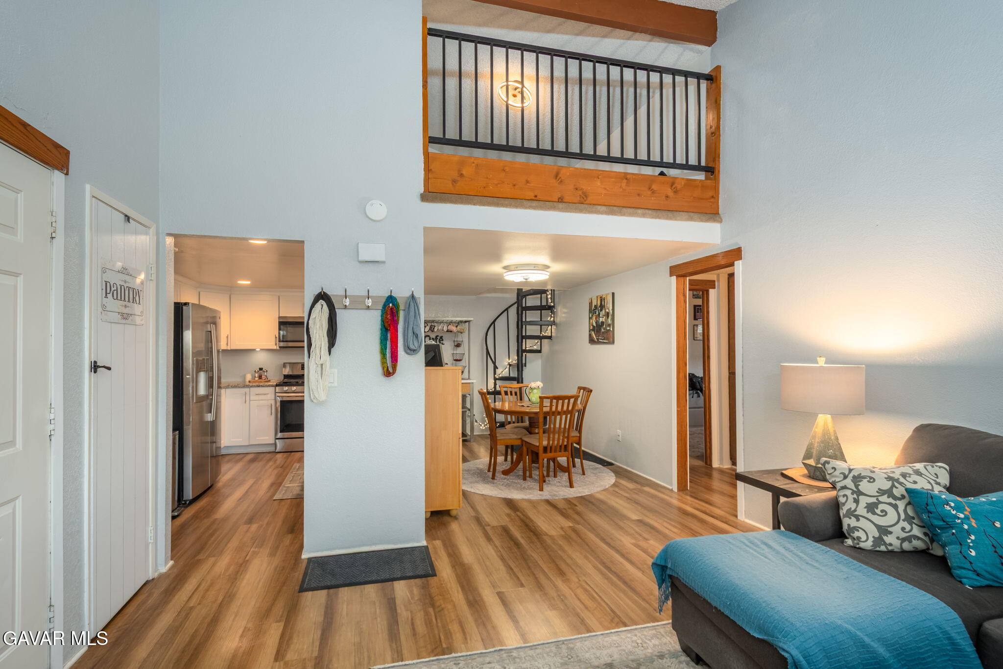44442 15th Street East, Unit 5 Lancaster, CA 93535 - Photo 20 of 23 a living room with furniture and a wooden floor