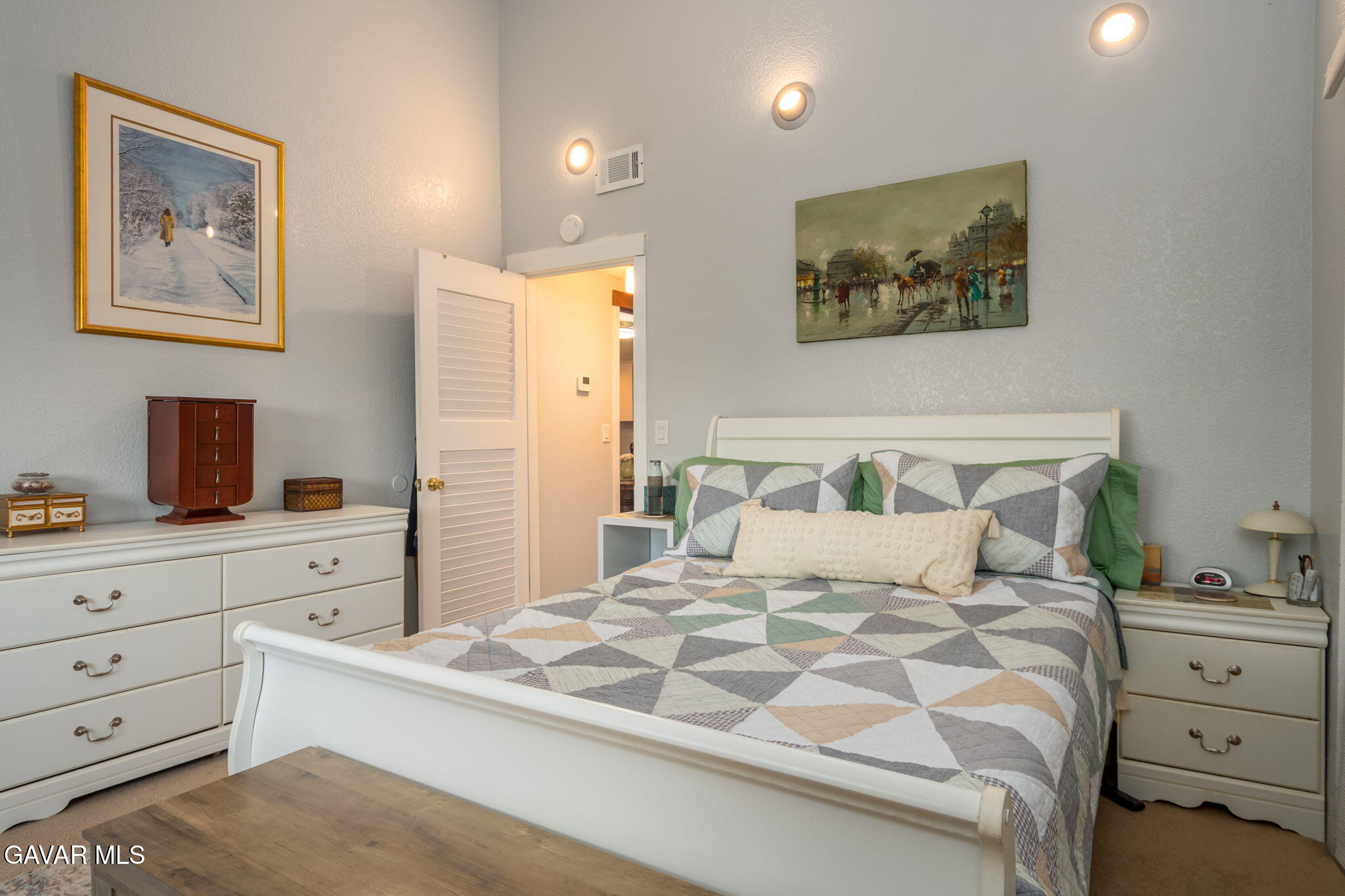 44442 15th Street East, Unit 5 Lancaster, CA 93535 - Photo 7 of 23 a bedroom with a bed and a dresser