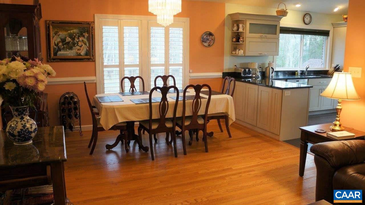 3621 Keswick Road Keswick, VA 22947 - Photo 12 of 50 a view of a dining room with furniture window and wooden floor