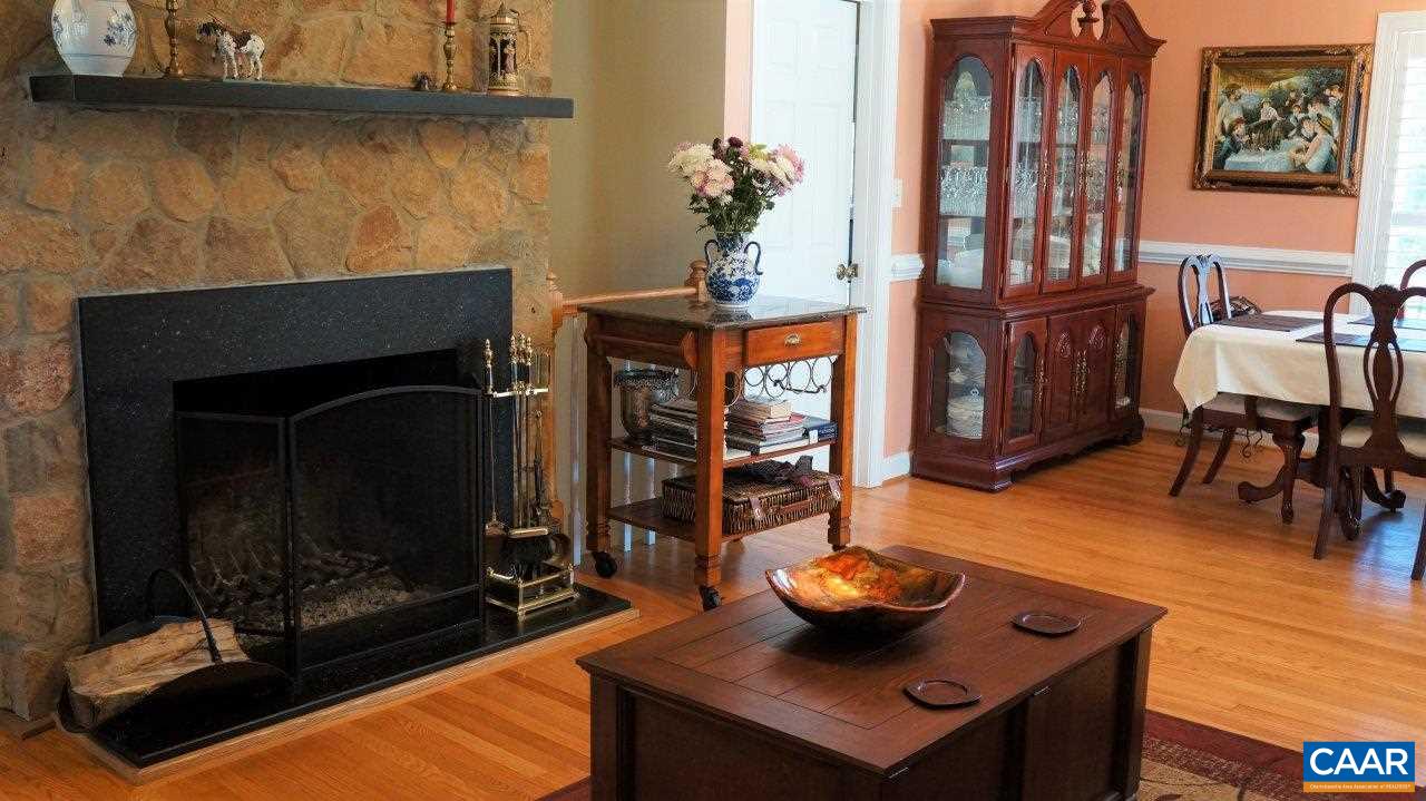 3621 Keswick Road Keswick, VA 22947 - Photo 16 of 50 a dining room with furniture and wooden floor