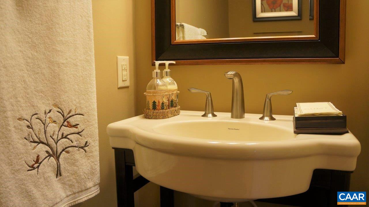 3621 Keswick Road Keswick, VA 22947 - Photo 18 of 50 a bathroom with a sink and a mirror