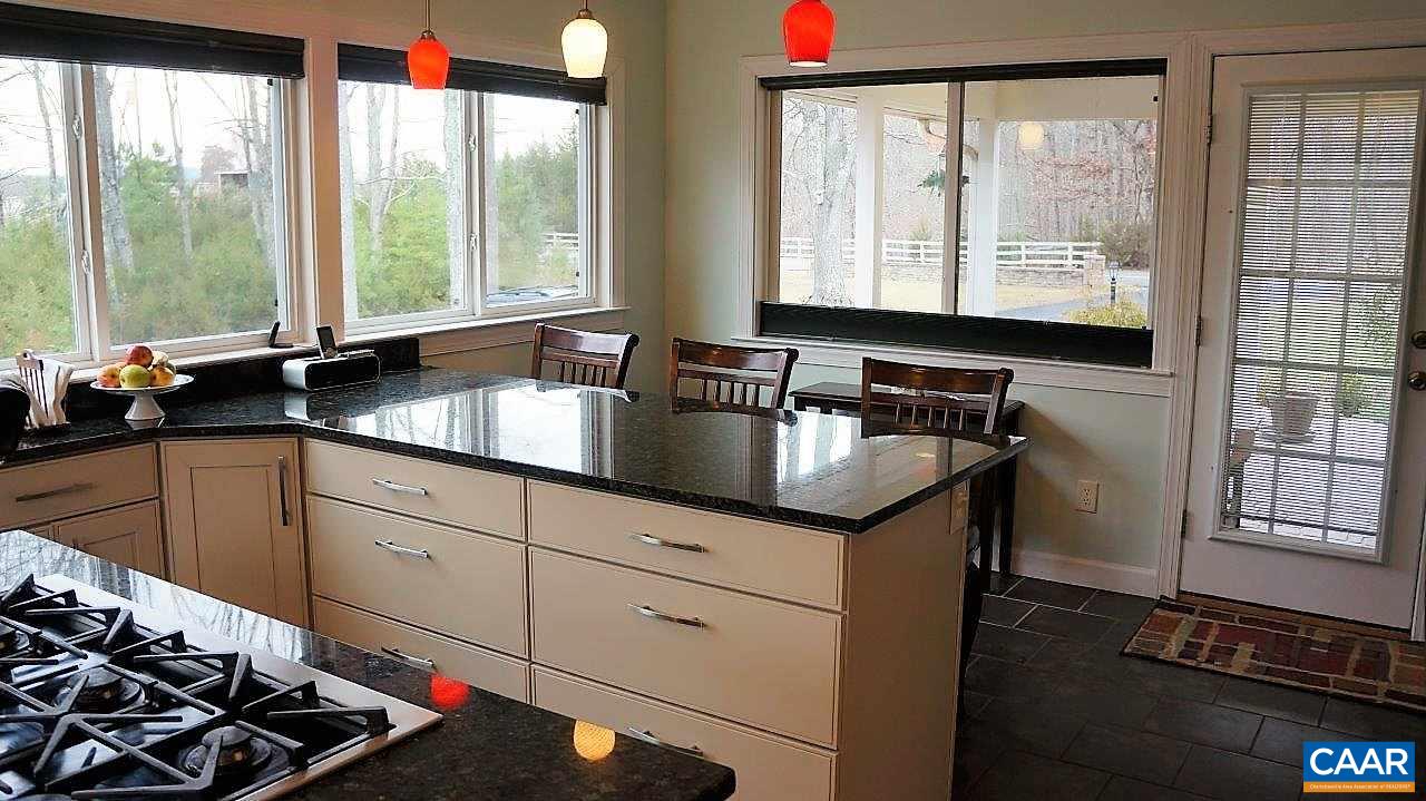 3621 Keswick Road Keswick, VA 22947 - Photo 21 of 50 a kitchen with granite countertop a sink and a window
