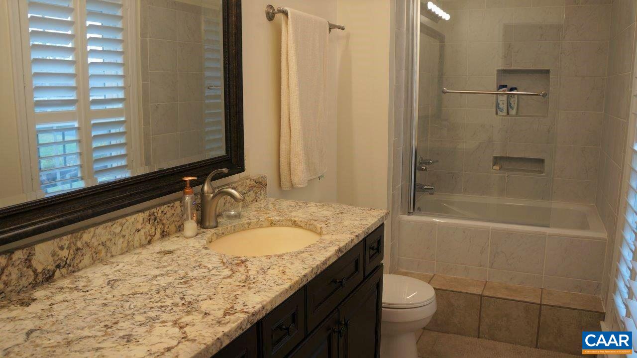 3621 Keswick Road Keswick, VA 22947 - Photo 25 of 50 a bathroom with a granite countertop sink toilet and shower