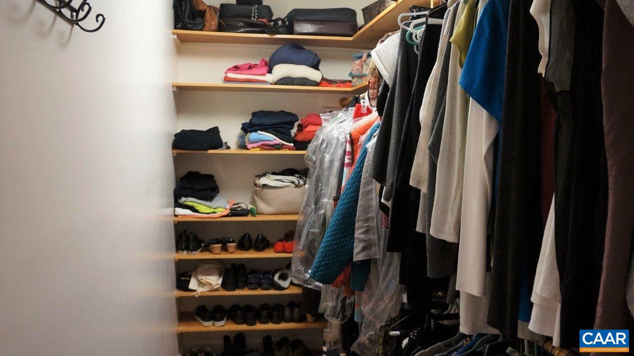 3621 Keswick Road Keswick, VA 22947 - Photo 30 of 50 a view of walk in closet with clothes and shoes