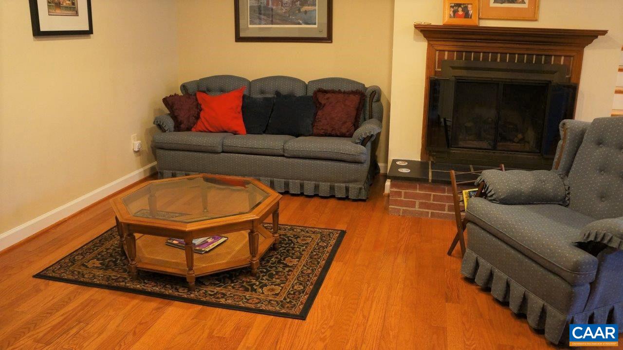 3621 Keswick Road Keswick, VA 22947 - Photo 33 of 50 a living room with furniture and a fireplace