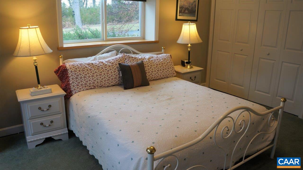3621 Keswick Road Keswick, VA 22947 - Photo 40 of 50 a bedroom with a bed and a window