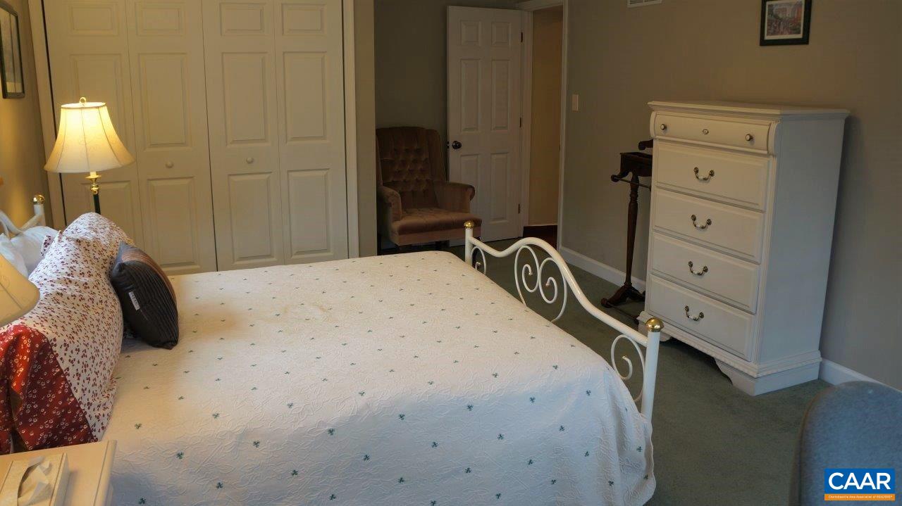 3621 Keswick Road Keswick, VA 22947 - Photo 41 of 50 a bedroom with a bed and a closet