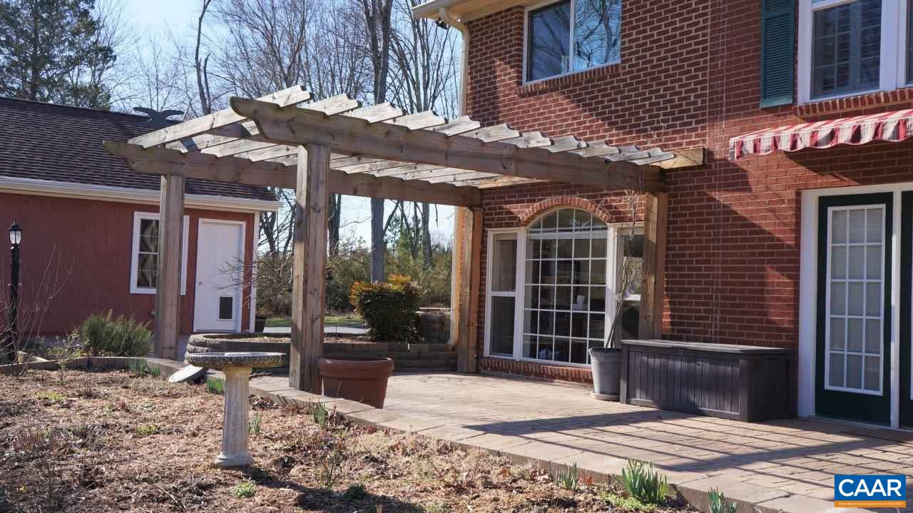 3621 Keswick Road Keswick, VA 22947 - Photo 45 of 50 a front view of a building with a garden