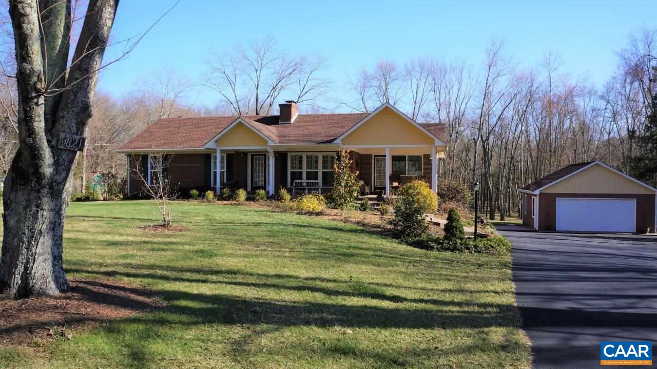 3621 Keswick Road Keswick, VA 22947 - Photo 10 of 50 a view of a house with a big yard potted plants and large tree