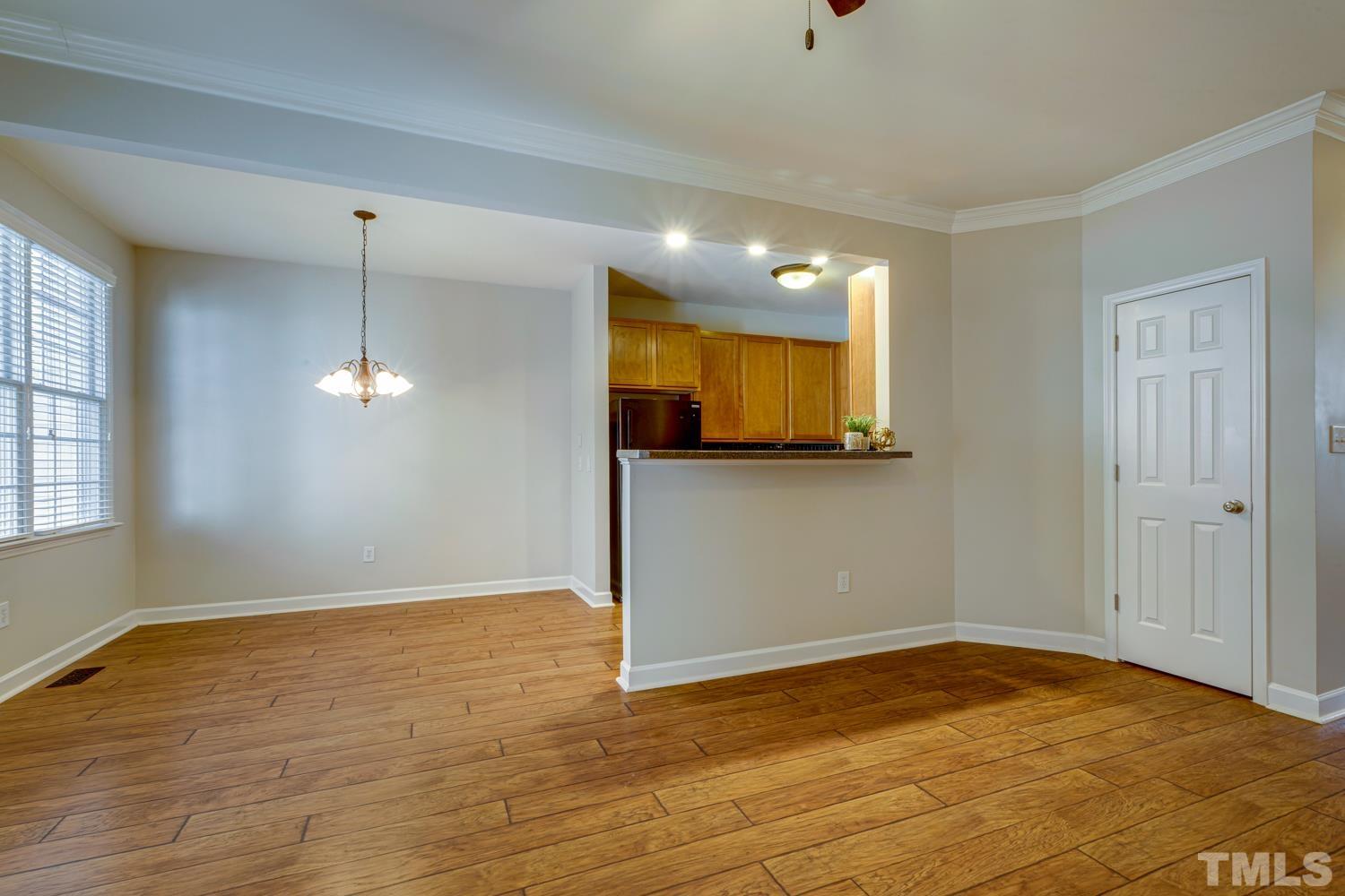 5405 Goldenglow Way Raleigh, NC 27606 - Photo 8 of 30 a view of a room with wooden floor and window
