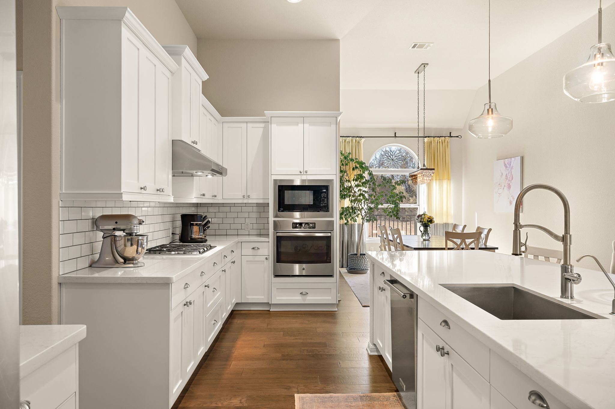 5016 Yucca Flower Lane Georgetown, TX 78626 - Photo 6 of 30 a kitchen with stainless steel appliances granite countertop a sink and oven
