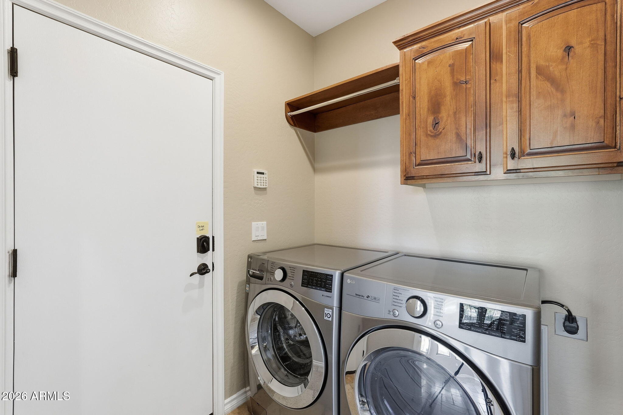 1694 East Grand Ridge Road Queen Creek, AZ 85140 - Photo 21 of 61 a utility room with dryer and washer