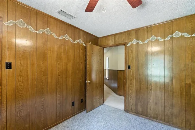 a bathroom with a glass shower door and a shower curtain