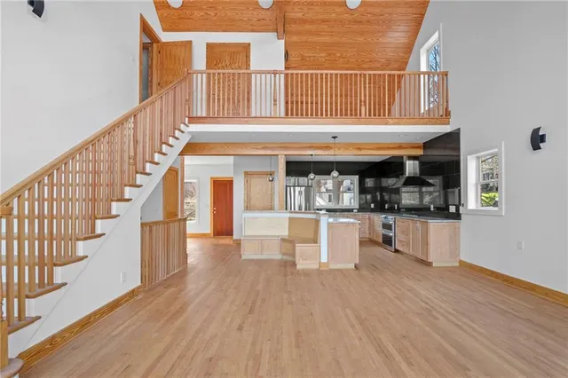 a view of an entryway with wooden floor