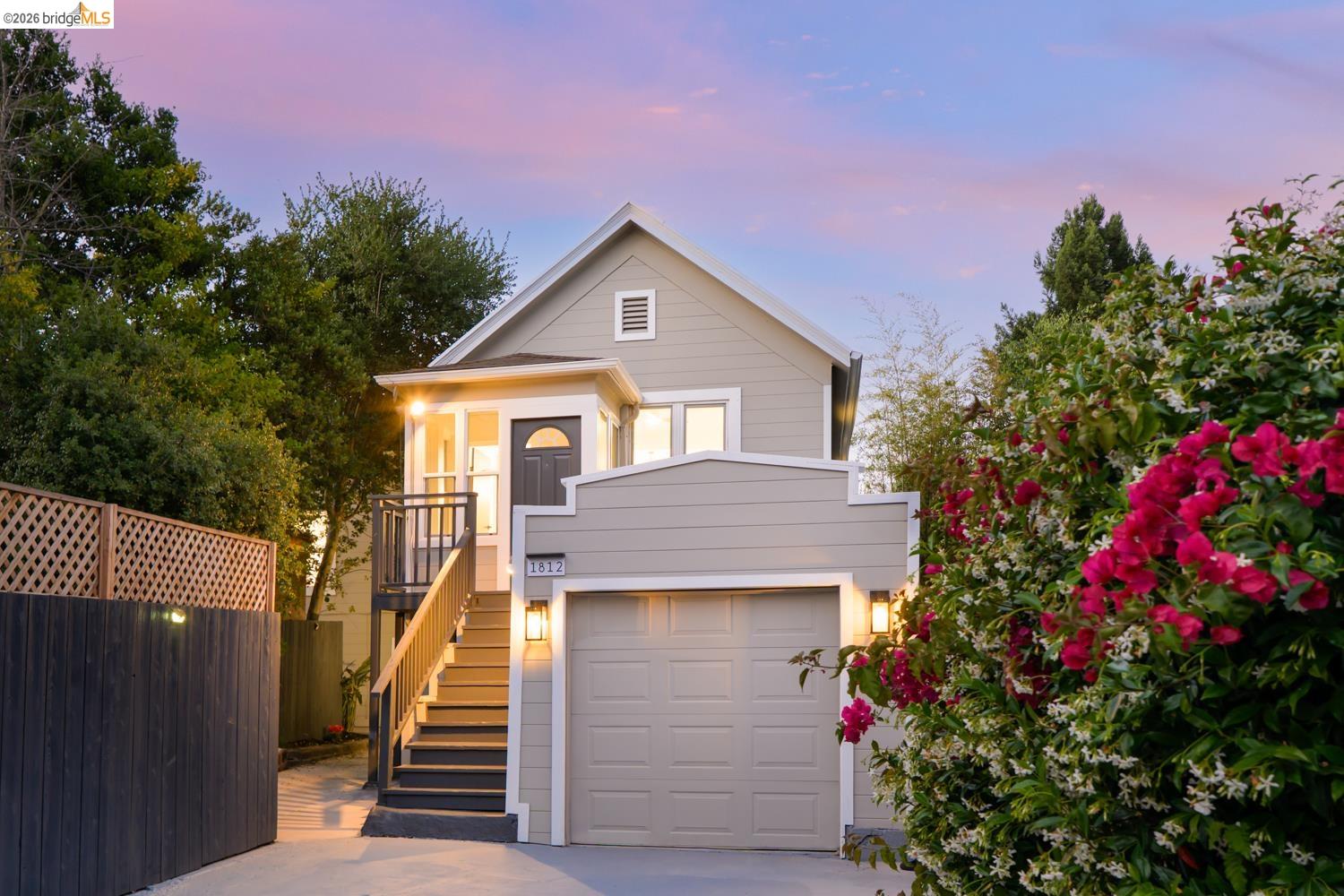 1812 Woolsey Street Berkeley, CA 94703 - Photo 1 of 48 Light gray siding exterior with a prominent attached garage