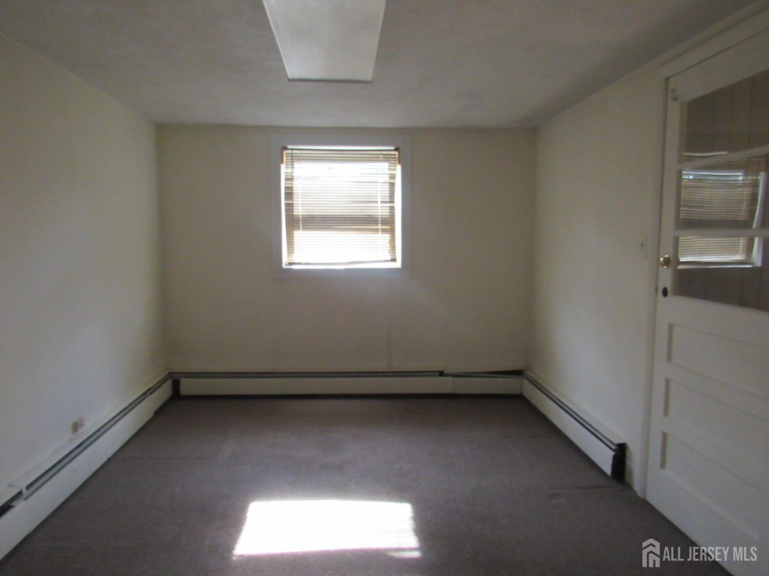 206 Overbrook Road Piscataway, NJ 08854 - Photo 11 of 34 an empty room with a window