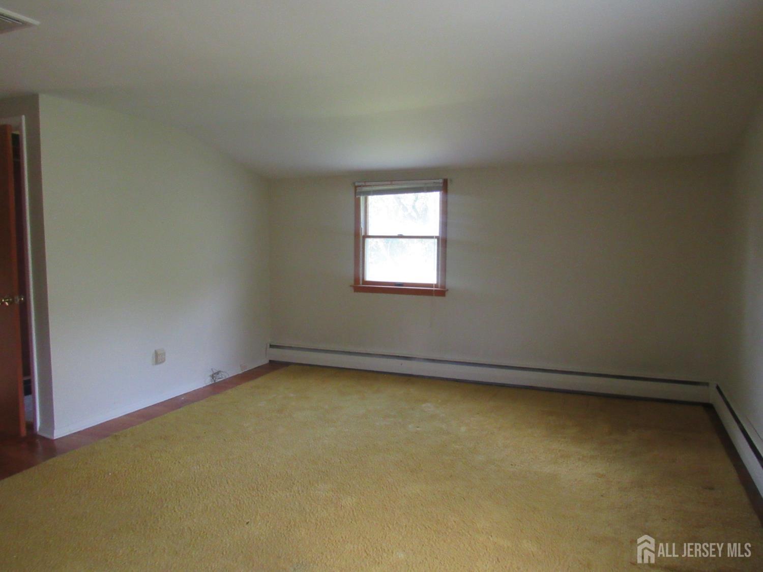 206 Overbrook Road Piscataway, NJ 08854 - Photo 14 of 34 an empty room with a window