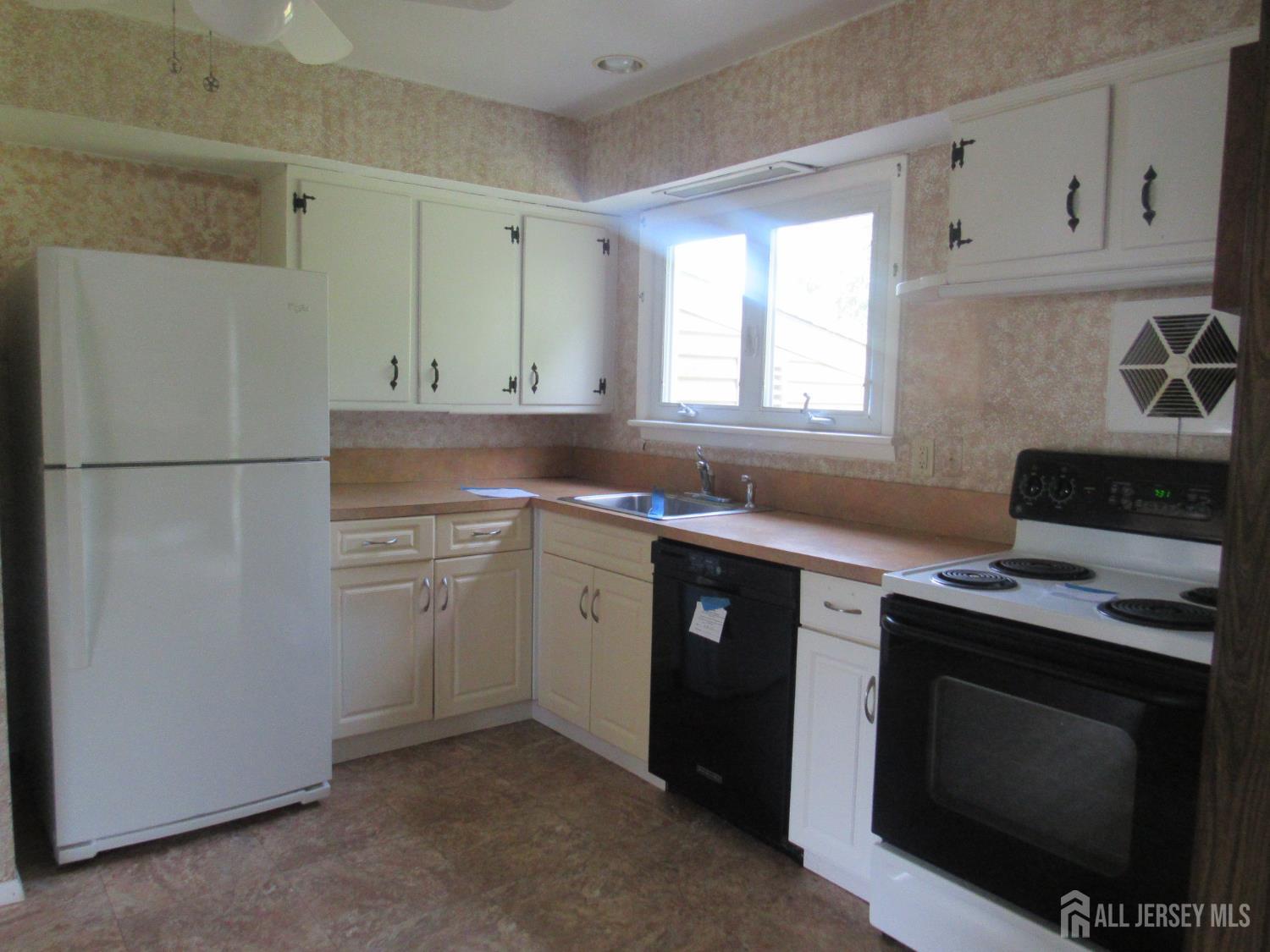 206 Overbrook Road Piscataway, NJ 08854 - Photo 26 of 34 a kitchen with a stove and a refrigerator