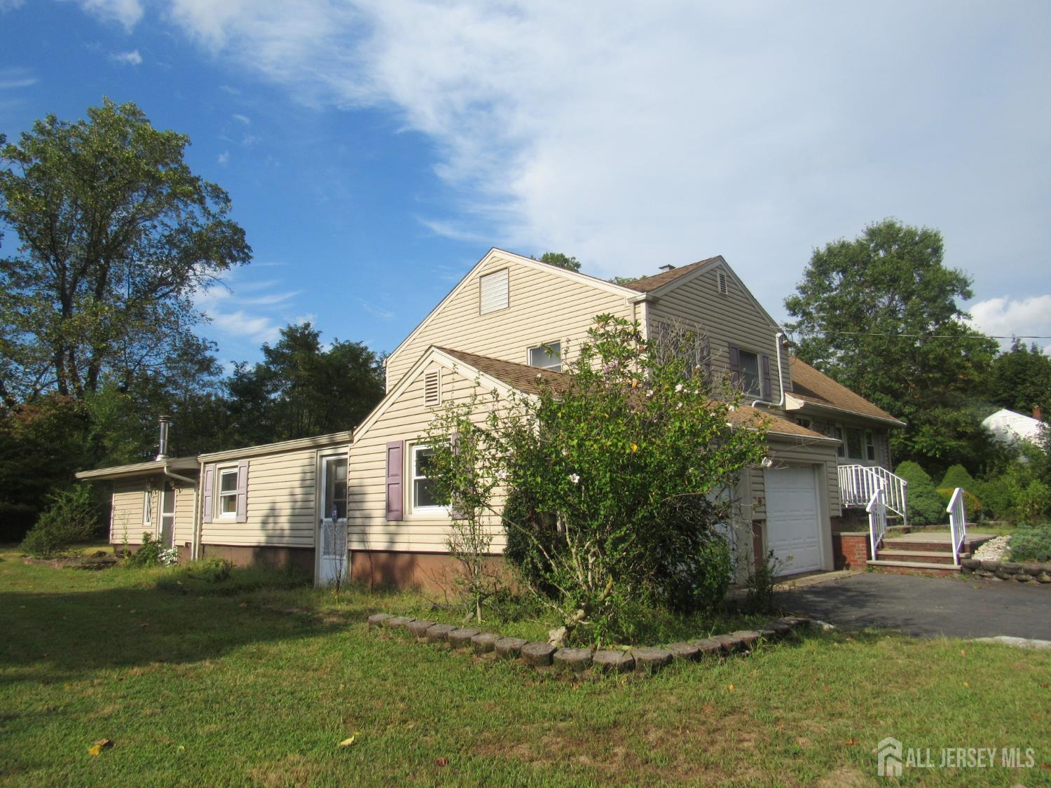 206 Overbrook Road Piscataway, NJ 08854 - Photo 30 of 34 a front view of a house with a garden