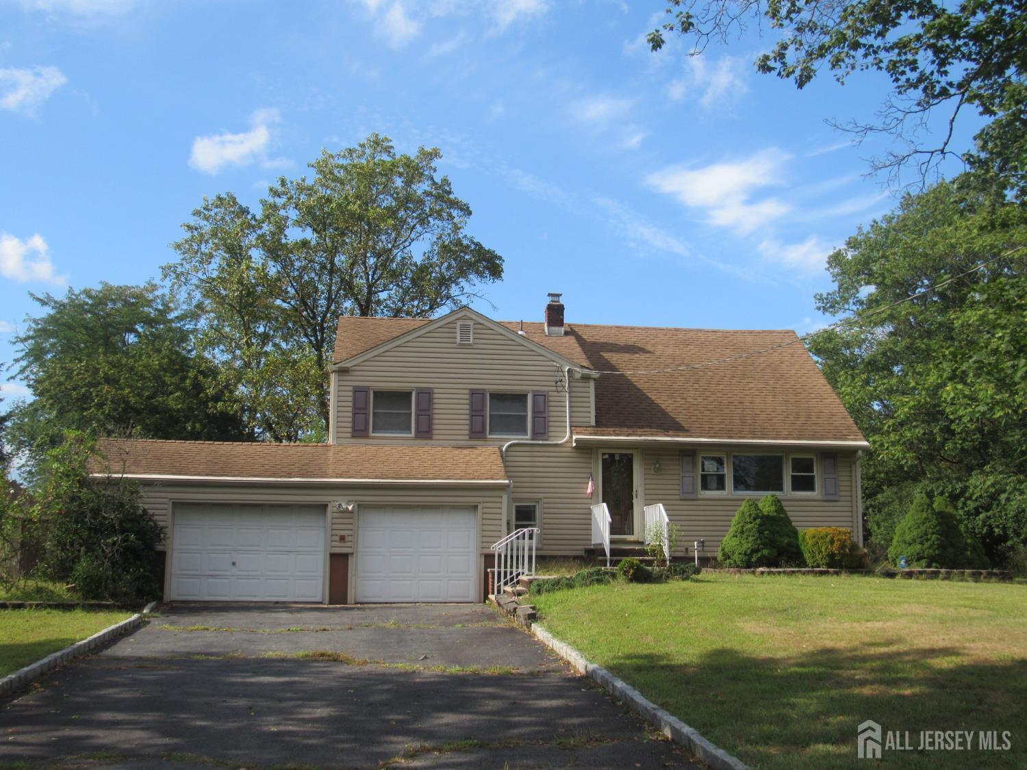 206 Overbrook Road Piscataway, NJ 08854 - Photo 33 of 34 a front view of a house with a garden