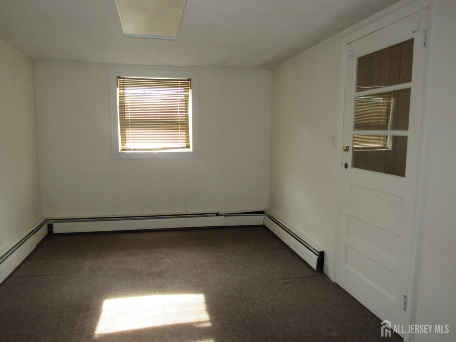 206 Overbrook Road Piscataway, NJ 08854 - Photo 9 of 34 an empty room with a window