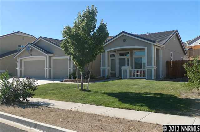 1485 Hagar Road Reno, NV 89506 - Photo 1 of 1 a front view of a house with a yard and garage
