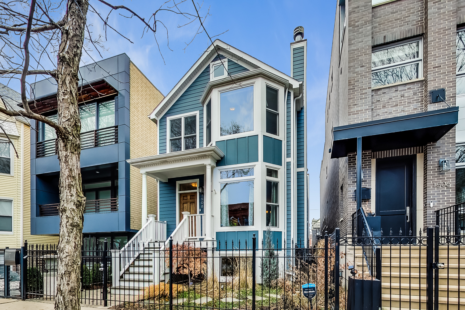 a front view of a house with glass windows