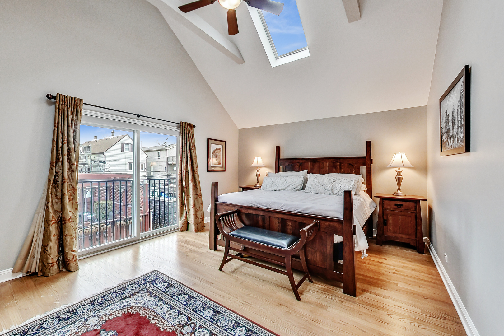 1508 West School Street Chicago, IL 60657 - Photo 14 of 40 a bedroom with a bed a flat screen tv and next to a window